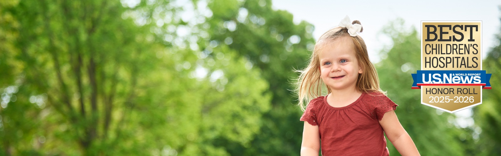 young girl smiling outdoors