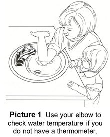 Person putting their elbow in water to check temperature.