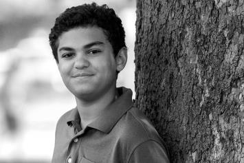 Pre Teen Boy Leaning on a Tree