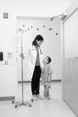 Dr. Liao standing with patient