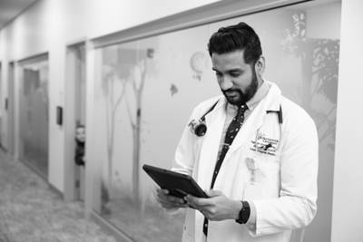 doctor looking at tablet