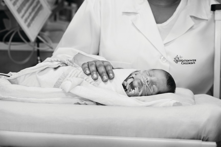 Infant in the NICU at Nationwide Children's Hospital hooked up to feeding tubes.