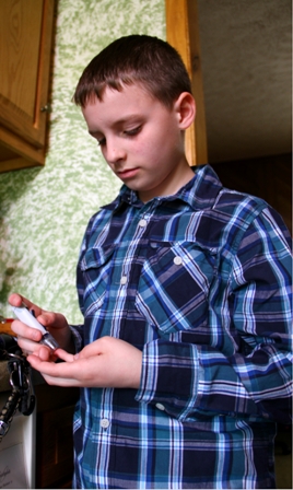 Diabetes patient checks his blood