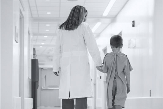 Medical provider walking with a patient