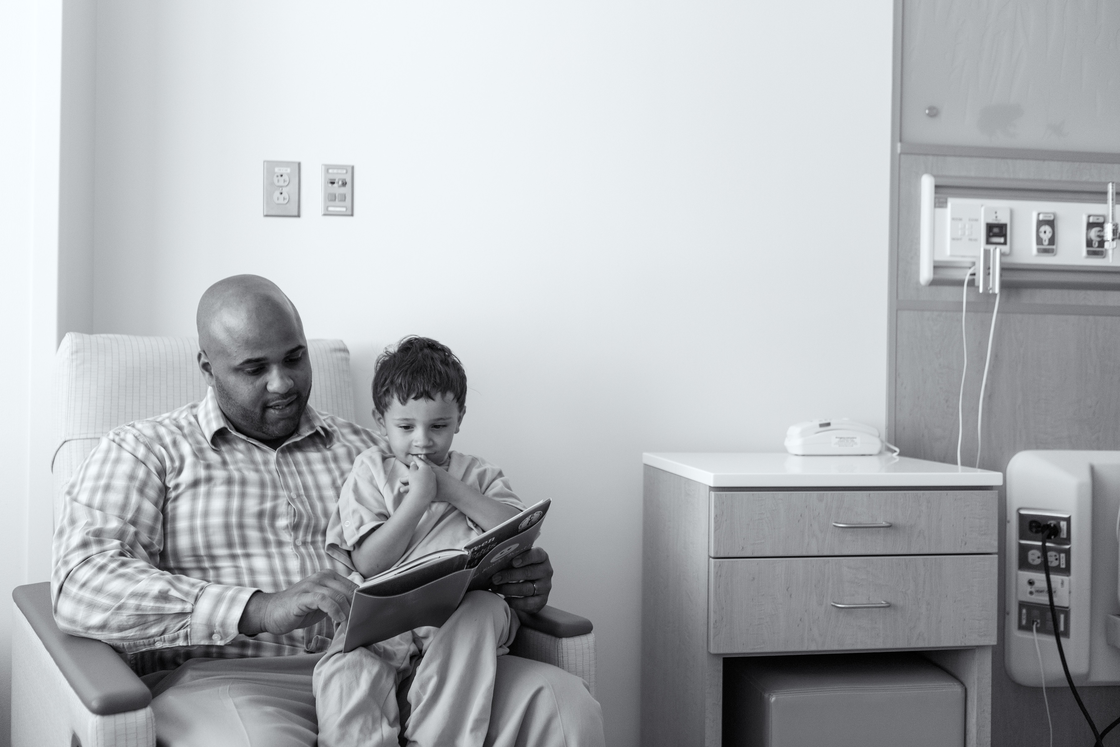 Father Reading to Patient